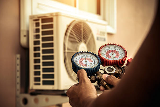 Professional Air Conditioning Service technician working in Hinckley, MN